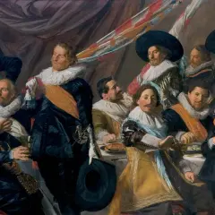 A group of men in 17th-century attire, including the laughing cavalier, gather around a table.