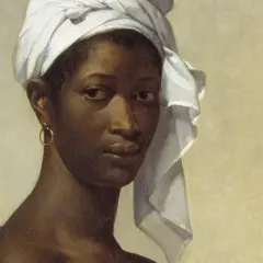 A striking portrait of Madeleine, her gaze direct, a white turban framing her face, and a gold hoop earring adorning her ear.