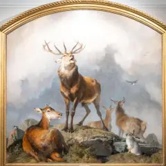 Two women admire a dramatic painting of a stag, deer, and rabbits, reminiscent of Edwin Landseer paintings, in a gallery.