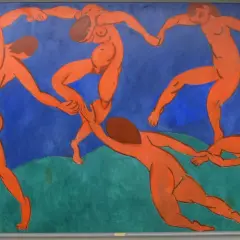 Five nude figures dance in a circle against a vibrant blue background, a signature style of Fauvism artists.