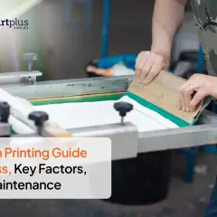 A person demonstrates how to screenprint, using a squeegee to apply ink on a screen. This image is part of a guide on the screen printing process.