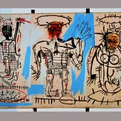 Basquiat's triptych meaning unfolds through three raw figures, their bodies outlined in black, with splashes of blue and red.