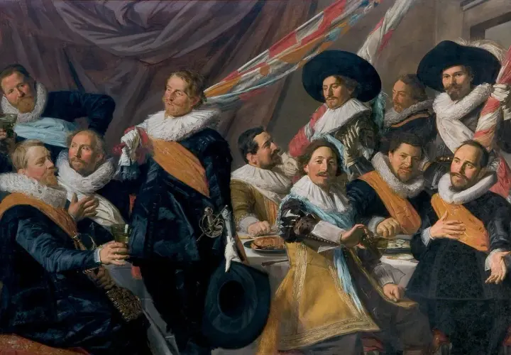 A group of men in 17th-century attire, including the laughing cavalier, gather around a table.