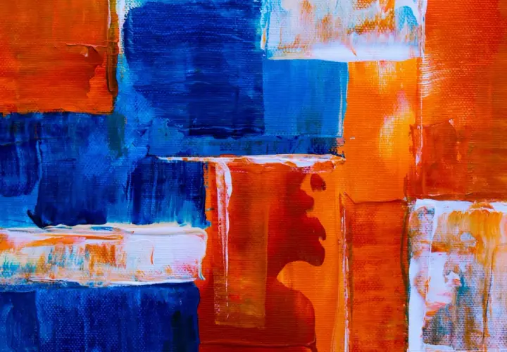 Bold strokes of blue and orange create a dynamic composition, showcasing various types of abstract art with thick impasto textures.