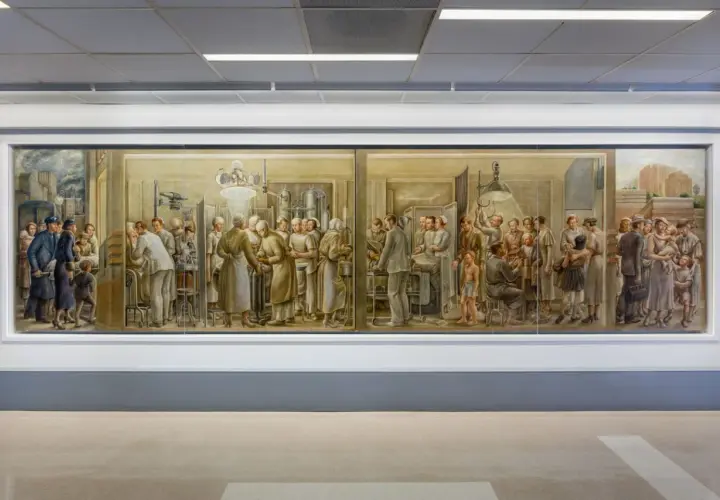 A mural depicting scenes of medical care, showcasing doctors and nurses tending to patients, a testament to famous medical paintings and the history of healing.