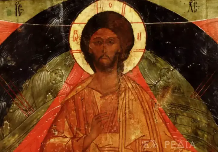 Icon of Christ the Pantocrator, with a golden halo and serene gaze, flanked by winged figures.