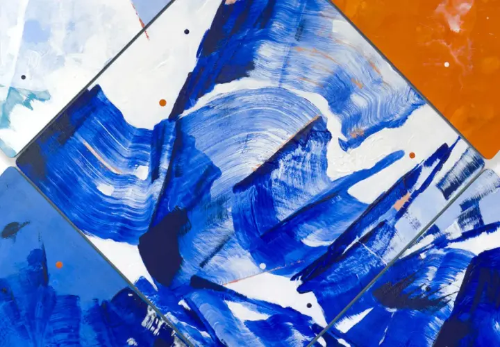 Vibrant abstract art examples featuring bold blue brushstrokes on white, with pops of orange and subtle pink accents.