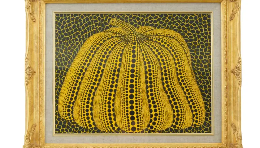 A vibrant yellow pumpkin, a signature motif of the spotted pumpkin artist, is depicted in this framed artwork. The pumpkin is covered in black dots, set against a black background with yellow netting.