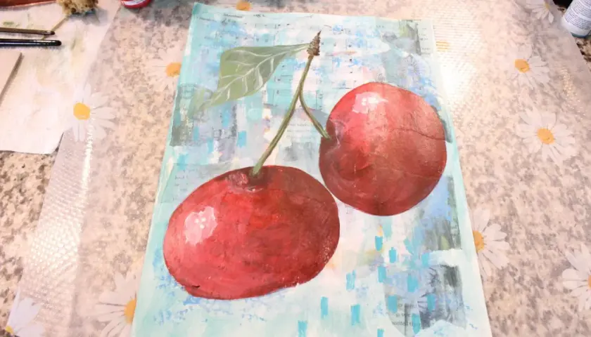 A vibrant collage and painting features two juicy cherries against a background of sheet music and abstract blue strokes.