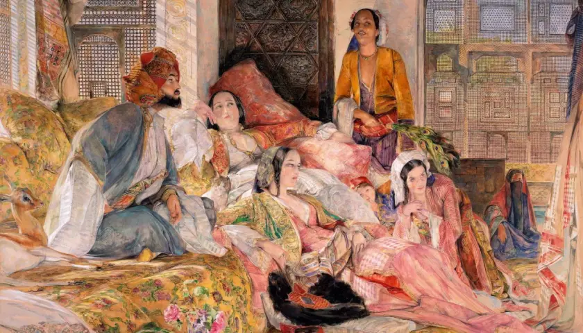 A history painting depicting a man in a turban and several women in opulent attire lounging on cushions, with a gazelle nearby.