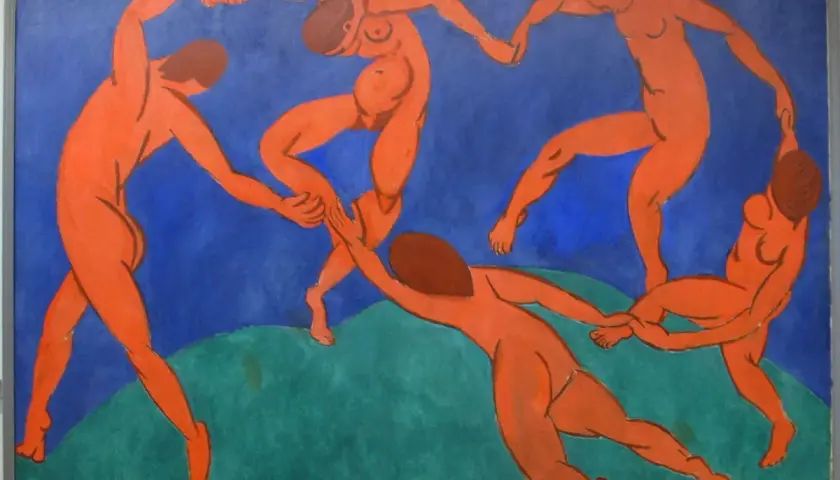 Five nude figures dance in a circle against a vibrant blue background, a signature style of Fauvism artists.