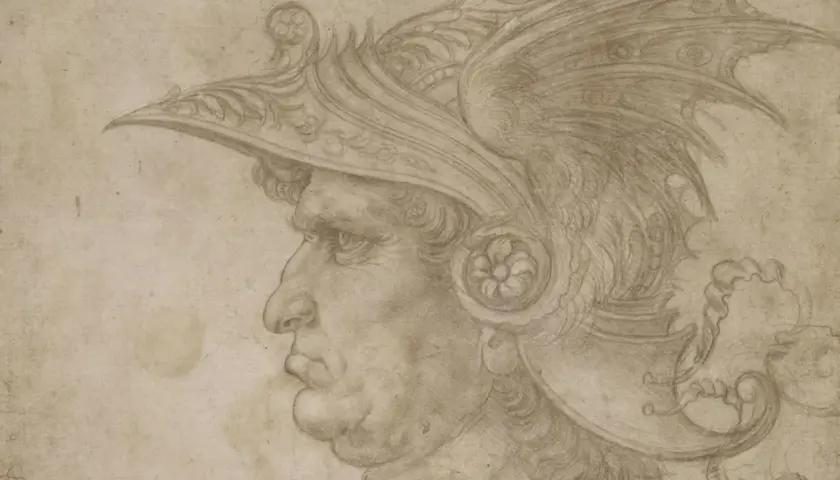Profile of a man in a detailed helmet, rendered with delicate silver point lines. The drawing captures the warrior's stern expression and the ornate design of his headwear.