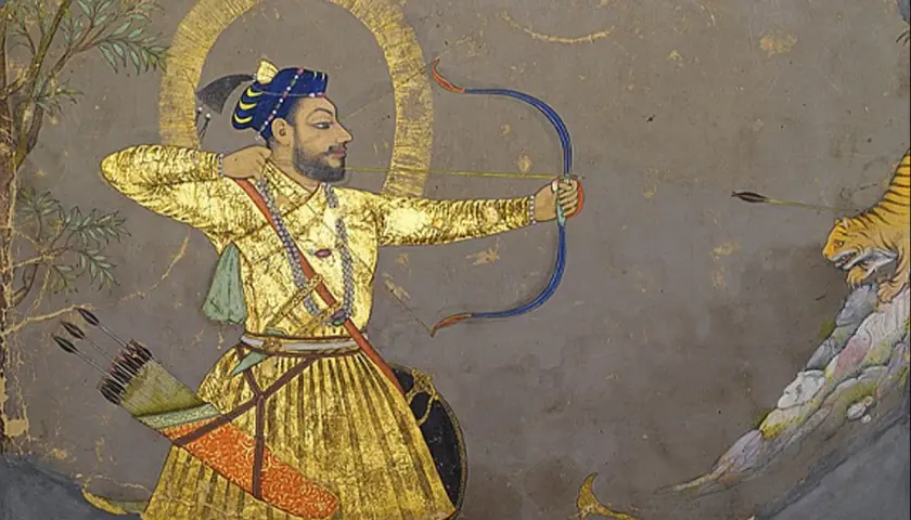 A Mughal miniature painting depicts a man in a golden robe aiming a bow and arrow at a tiger.