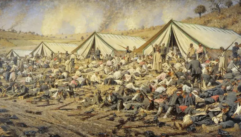 A battlefield scene by Vasily Vereshchagin depicts rows of tents and countless fallen soldiers, some wounded, others deceased, amidst scattered weapons and smoke rising in the distance.