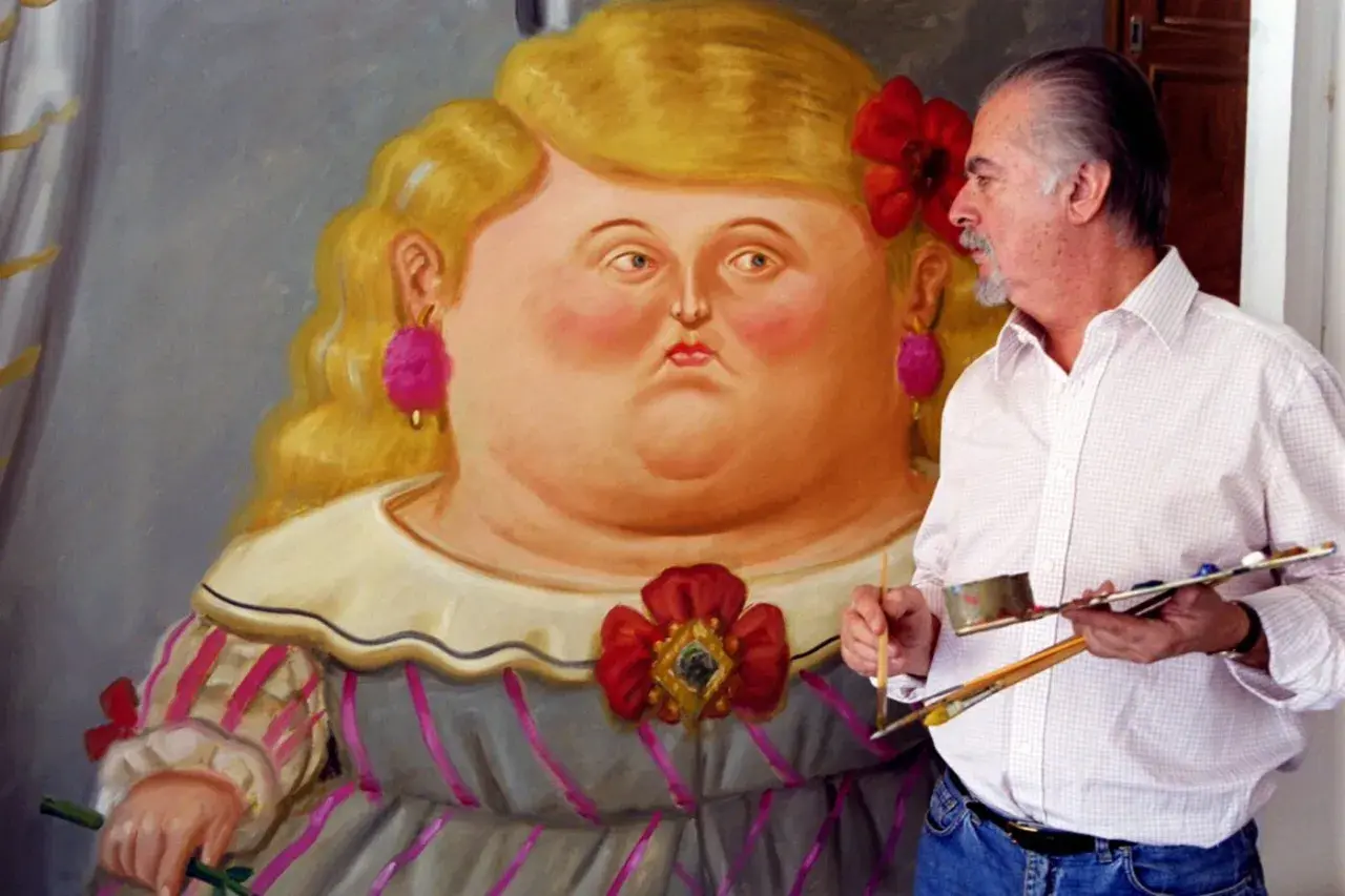 Artist Fernando Botero with a palette and brushes, standing next to a painting of a voluptuous woman in his signature style.
