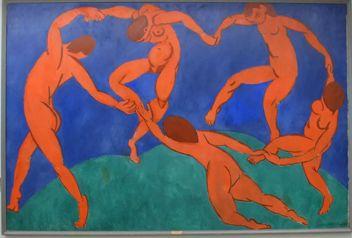 Five nude figures dance in a circle against a vibrant blue background, a signature style of Fauvism artists.