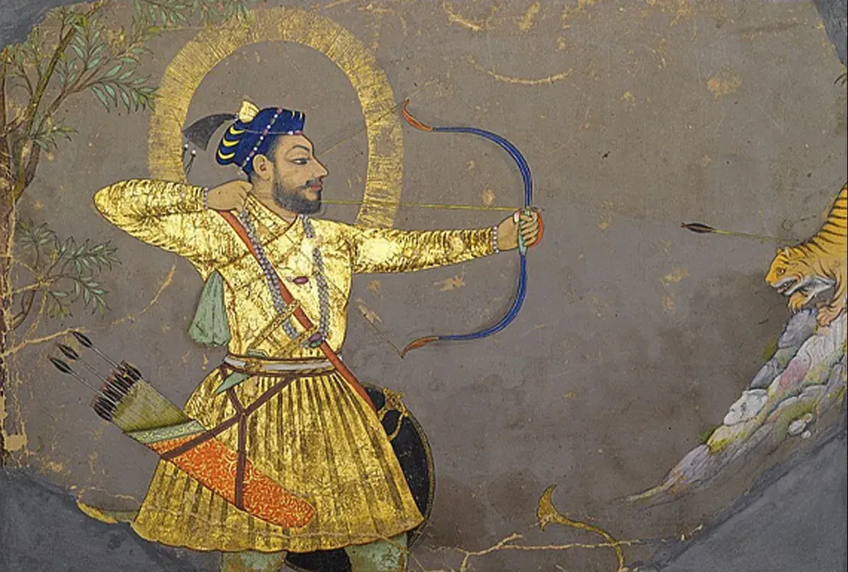 A Mughal miniature painting depicts a man in a golden robe aiming a bow and arrow at a tiger.