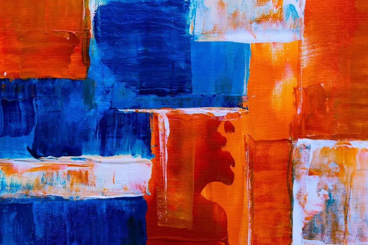 Bold strokes of blue and orange create a dynamic composition, showcasing various types of abstract art.